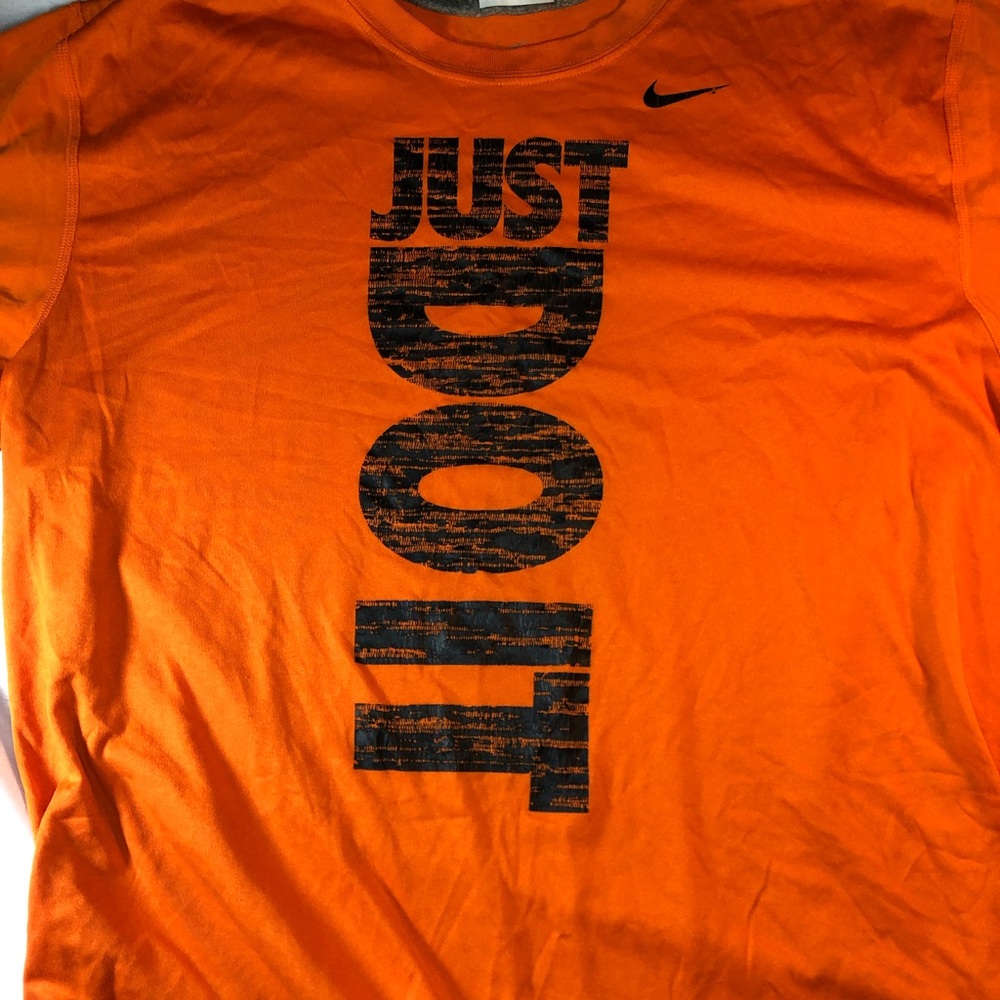Men's orange Nike shirt in medium